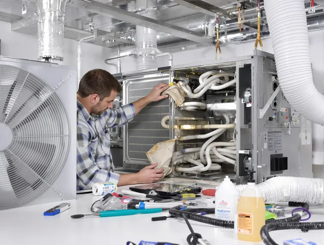 Lakeville Air Duct Cleaning specialist performing precision AC coil cleaning in Lakeville