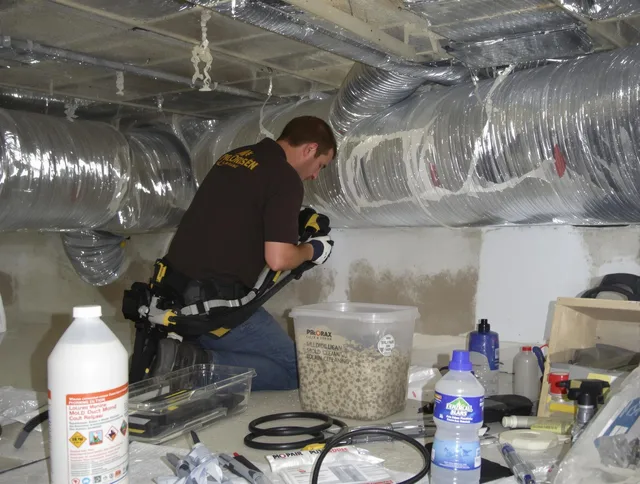 Lakeville Air Duct Cleaning specialist performing professional mold removal from air ducts in Lakeville