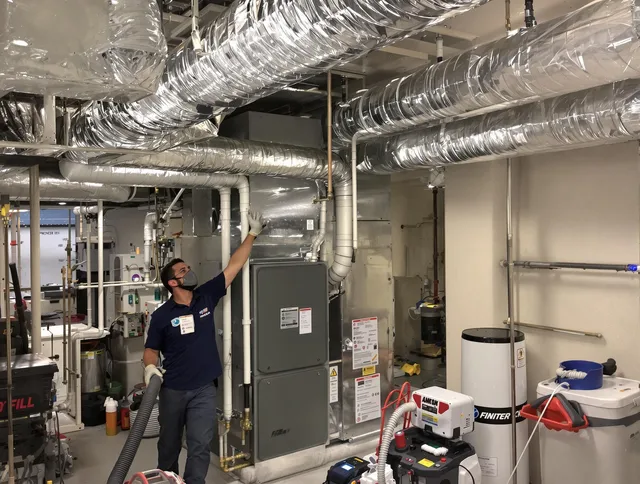 Lakeville Air Duct Cleaning specialist performing thorough furnace duct cleaning in a Lakeville residence