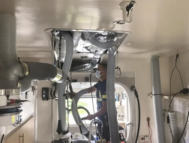 Lakeville Air Duct Cleaning specialist performing precise mobile home duct cleaning in Lakeville