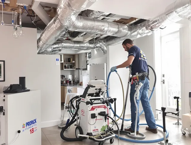 Lakeville Air Duct Cleaning technician performing advanced pure duct cleaning with specialized equipment in Lakeville