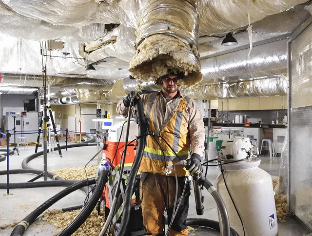 Professional vacuum insulation removal by Lakeville Air Duct Cleaning expert in Lakeville